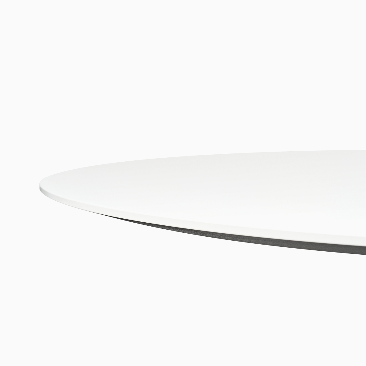 A round white Civic Table with a contrasting edge.