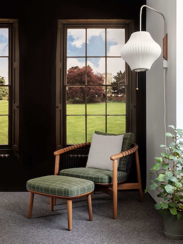 Crosshatch Chair and Ottoman against a Maharam digital print.