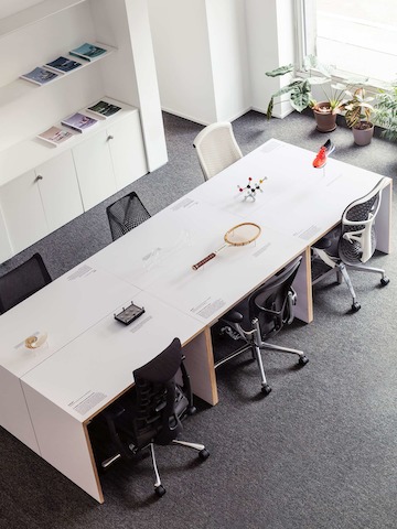 Display table with high-performance chairs around it.