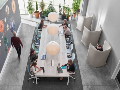 People working at a Layout Studio table with Keyn Chairs.