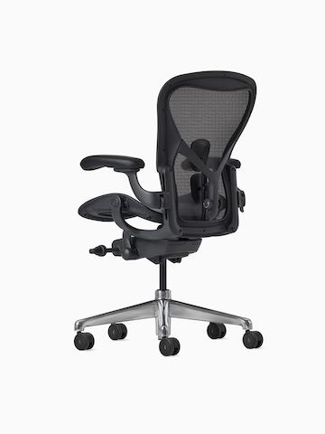 Rear-angle view of an Aeron ESD Chair in size B, with a granite frame and suspension and a polished base.