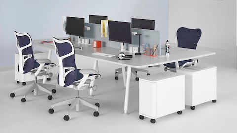 A collaboration area featuring Memo, Atlas Storage, and blue Mirra 2 office chairs.