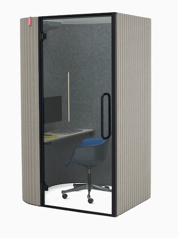 An angle view of a Bay Work Pod used for a video conference, paired with an Eames Task Chair.