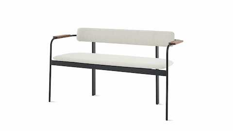 A Betwixt Bench with grey fabric seat and backrest, with walnut arms and a black frame.