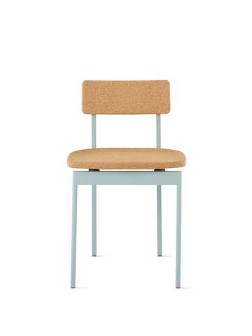 A Betwixt Chair with a cork seat and backrest with a glacier frame.