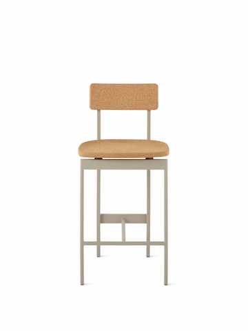 A counter-height Betwixt Stool with cork seat and backrest, with a grey frame.