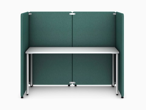 Four green Bound Freestanding Screens in a booth configuration around a white OE1 Rectangular Table, viewed from the front.