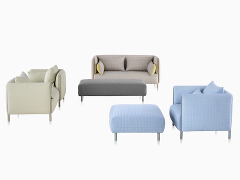 ColourForm seating pieces, including a loveseat and lounge chair, two ottomans, and a tête-à-tête formed from two modules.
