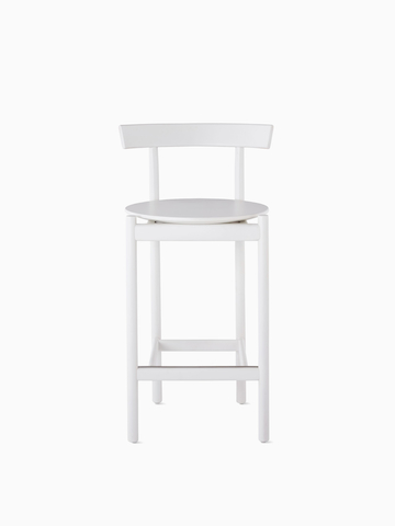 A white counter-height Comma Stool, viewed from the front.