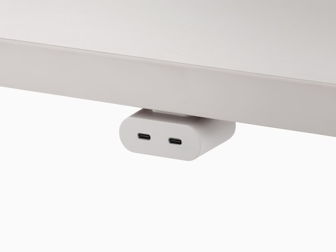 White Ello Mini USB-C power access module that is attached to a white surface.