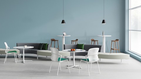 An open plaza area with a variety of seating options arranged around Everywhere Tables of differing heights.