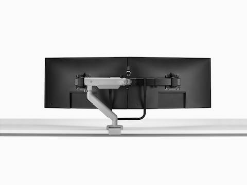 Silver Flo X Dual monitor arm set up with 32'' screens, viewed from the back.