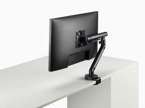 Flo Single monitor arm in black viewed at an angle.