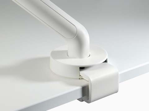 A close-up of a white Flo Single top-mount clamp.