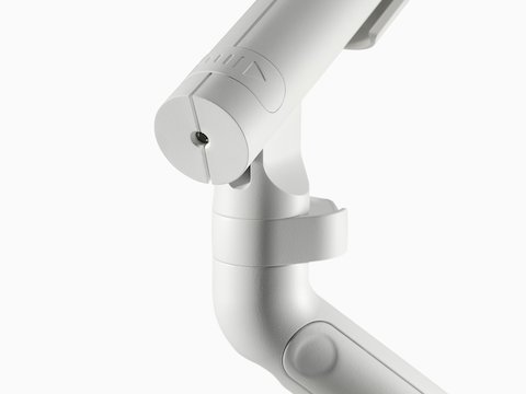 A close-up of a Flo Single monitor arm with directional indicator in white.