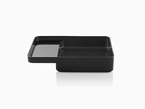 Profile view of the large version of a black Formwork Tray with a deep rear compartment and cantilevered front compartment.