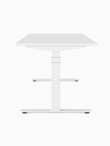 A white Nevi Sit-Stand Desk at seated height, viewed from the side.