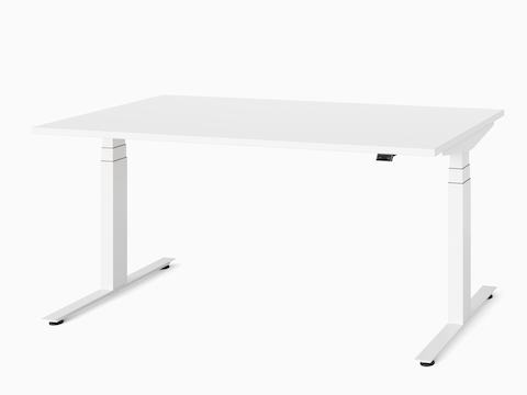 A white Nevi Sit-Stand Desk at seated height, viewed at an angle.
