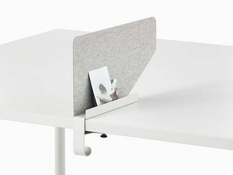 Grey OE1 Boundary Screen with liner on a white OE1 Rectangular Table, viewed from an angle.