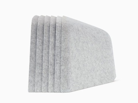 Six grey OE1 Personal Hoodies stacked together, viewed from the side.