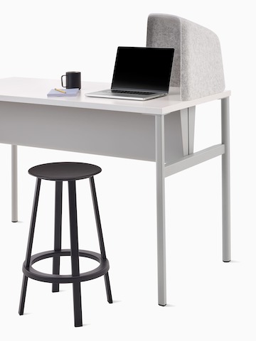 Grey OE1 Personal Hoodie on a grey and white OE1 Communal Table and a dark grey Revolver Stool.