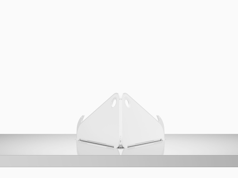 A back view of an open Oripura Laptop Stand on top of a worksurface.