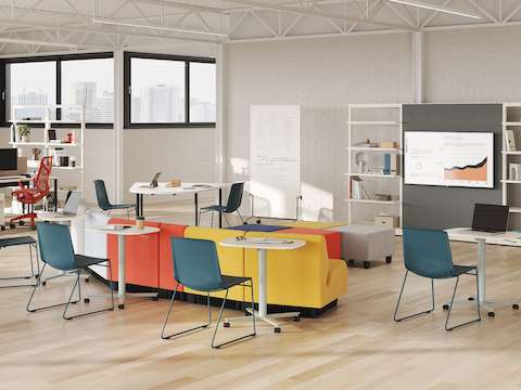 A selection of large Passport Work Tables are featured in a team collaboration setting.