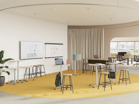 A selection of large Passport Work Tables are featured in a team collaboration setting.