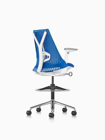 Three-quarter rear view of a blue Sayl Stool. 