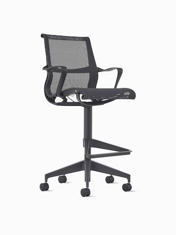 Front-angle view of a Setu Stool with arms in dark grey.