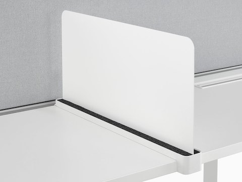 A Ubi Slim Screen serves as a boundary between workstations.