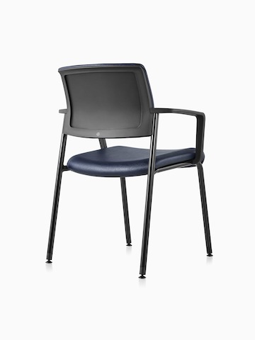 Three-quarter view of a Black Verus Side Chair with arms in blue vinyl upholstery and black upholstered back.