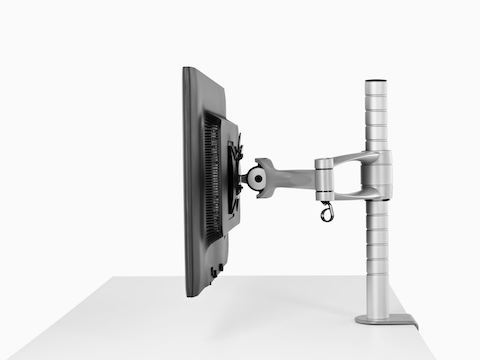 Profile view of a single monitor attached to a Wishbone Monitor Arm post.
