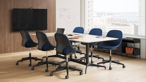 A refined video conferencing space with pops of energetic colour and a Civic Table surrounded by six Zeph Chairs.