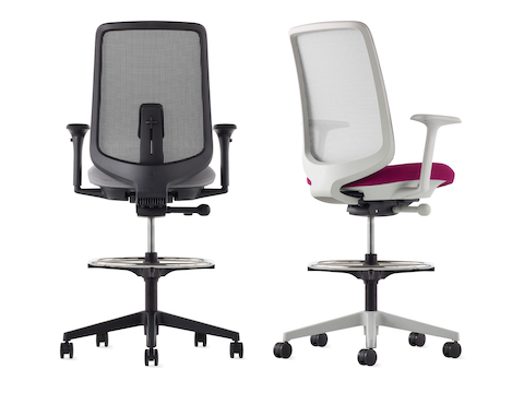 A black Verus Stool with a suspension back, grey seat and black frame viewed from the back and a Verus Stool with a suspension back, pink seat and mineral frame viewed at an angle.