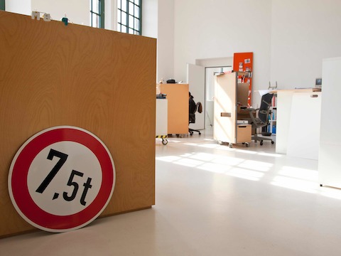 The reception desk and DTP work area is is a direct replica of the second floor of Studio 7.5's old studio where Carola often works to be close to Kerstin, the house graphic designer, and their secretary. Photo by Hello Design.