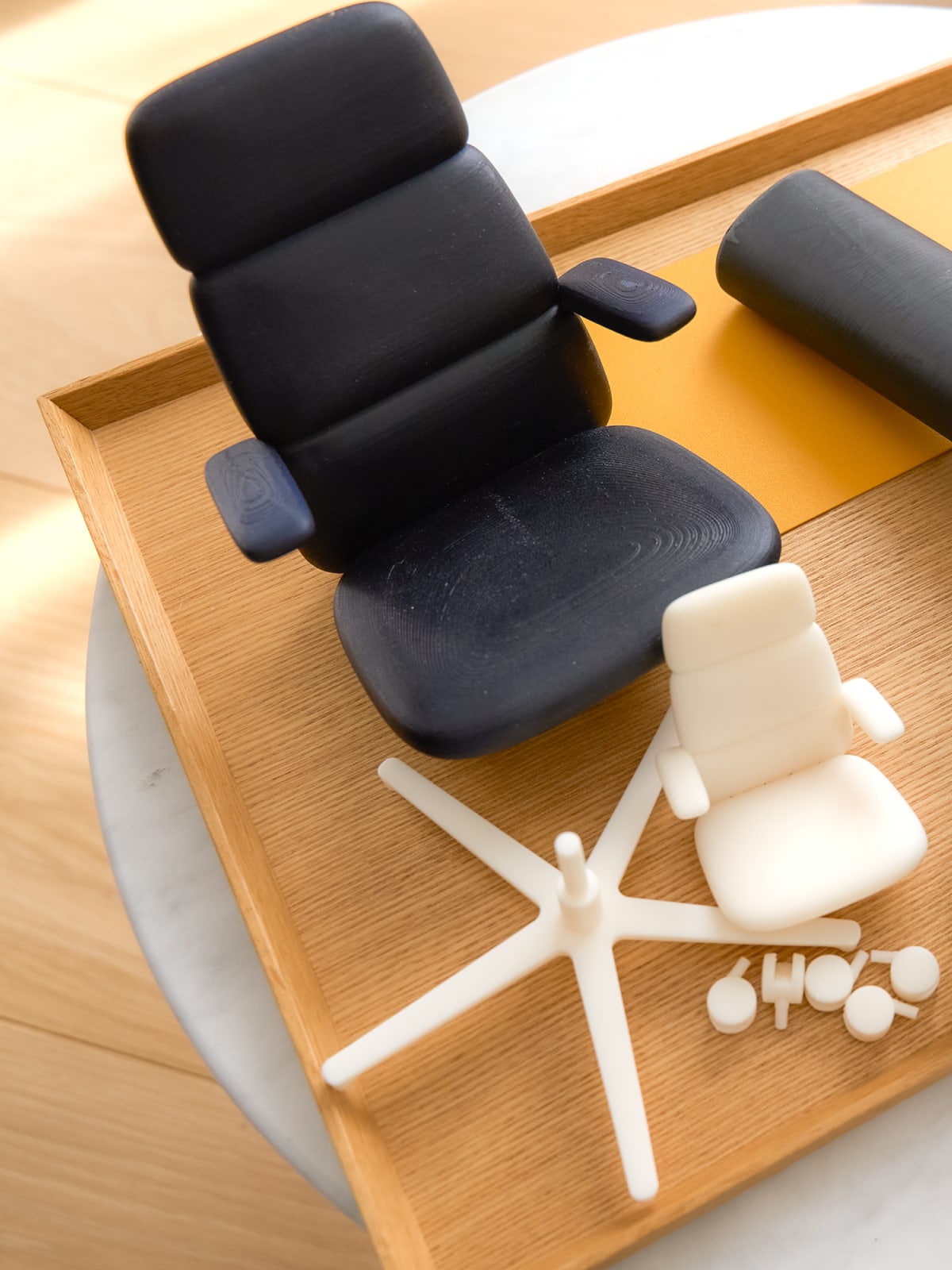 Multiple models of the Asari chair arranged on a platter.