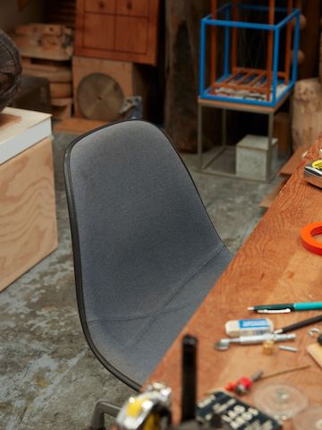 A vintage gray Eames chair in Jesse Schlesinger's studio.