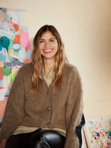 Kindah Khalidy in front of one of her paintings in her Berkeley, California, studio.