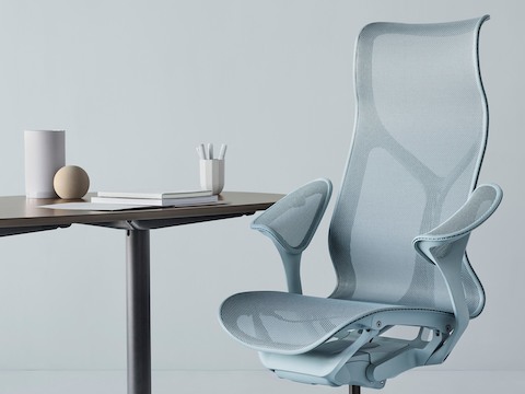Cosm high-back chair in light blue at a table.