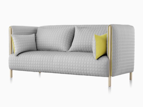 Oblique front view of a light gray ColourForm sofa. 