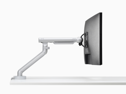 Flo Single monitor arm in silver viewed from the side.