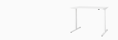 A white Nevi Sit-Stand Desk at standing height, viewed at an angle.