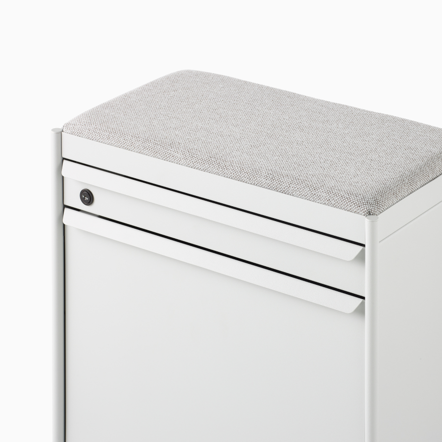 Close up image of a white individual OE1 Storage Trolley with drawer and tip-out bin, viewed from a front angle.