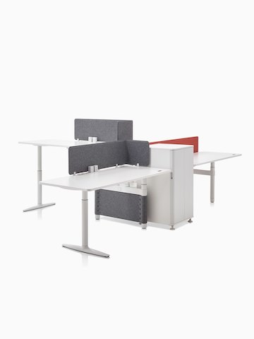 Three height-adjustable workstations designed for collaboration.