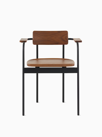 A Betwixt Chair with a walnut backrest, seat and arms with a black frame.