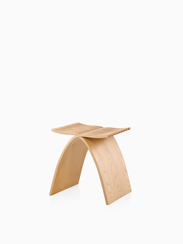 Angled view of a Capelli Stool in a light wood finish.