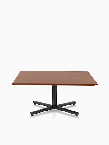 A square Everywhere Table with a medium wood finish.