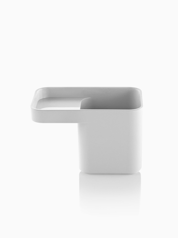 A white Formwork Pencil Cup with two compartments.