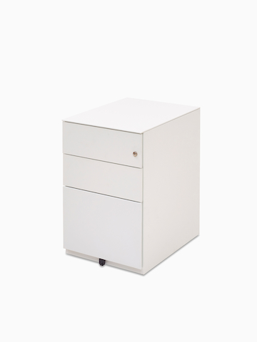 Angled view of a white Kumi pedestal with two box drawers and one file drawer.